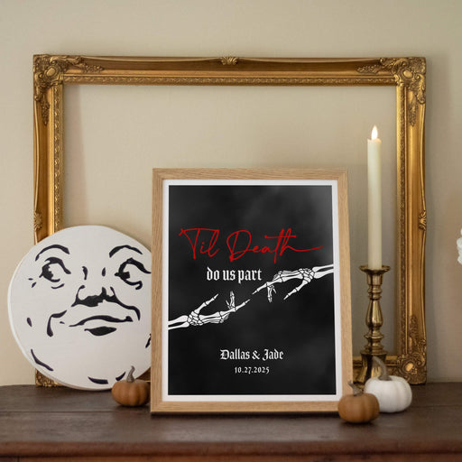 Framed artwork with 'Til Death Do Us Part' text and personalized name and wedding date on a shelf with decorative items