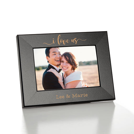 Vertical 4x6 custom picture frame that reads i love us and is personalized with the couples names.
